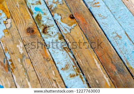 old boards with a shabby blue paint. background
