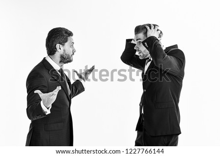 Machos in classic suits have business argument. Unshaven men argue, isolated on white background. Business controversy concept. Businessman with surprased face holds head. Royalty-Free Stock Photo #1227766144