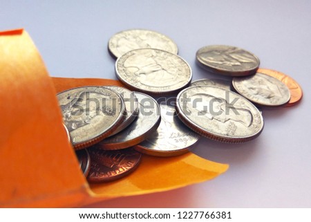 Close up image of American quarters usa in a bag on light background
