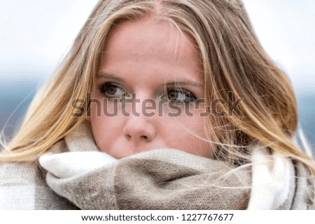 Teen covered with a scarf
