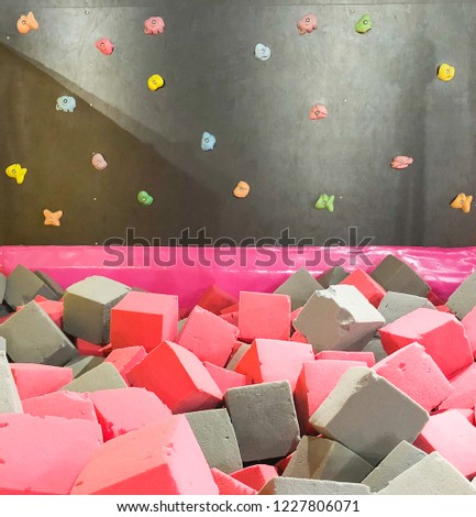 paralon soft cubes in  dry pool, trampoline in the children's center, climbing wall in the children's  gym