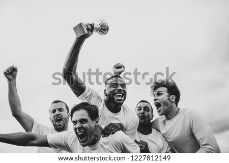 Soccer players team celebrating their victory Royalty-Free Stock Photo #1227812149