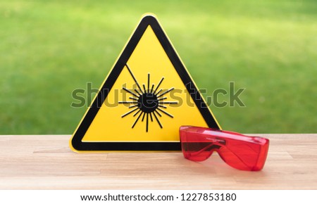 Laser safety sign and safety glasses