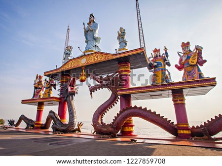 Statue of Dragons and Kwan yin in Sanggar Agung Temple or Hong San Tang. It is a Chinese temple in Surabaya  that located within Kenjeran Park, the Pantai Ria amusement park. Royalty-Free Stock Photo #1227859708