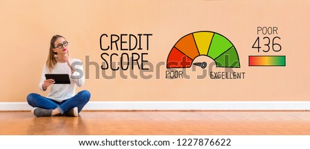 Poor credit score with young woman holding a tablet computer