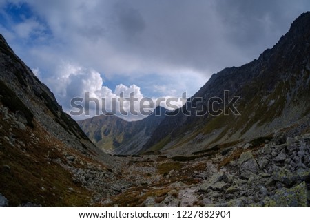 rocky hiking trails for tourists in western carpathian Tatra mountains in slovakia. clear summer day for hiking and adventure