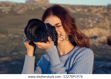 woman with a camera in nature                    