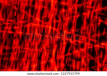 abstract image of Of the light,red light painting photography, long exposure waves and curves against a black background