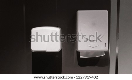 Hand Dryer and serviette paper in bathroom