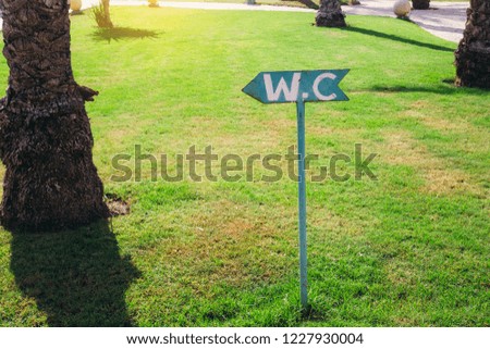 WC sign indication on the beach. outdoor