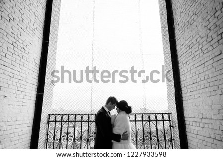 Bride and groom embrace