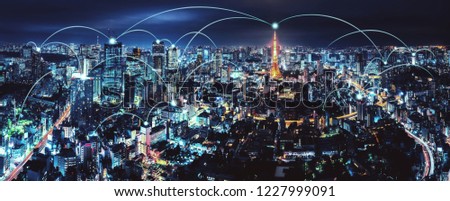 Wireless network and Connection technology concept with Tokyo city background at night in Japan, panorama view