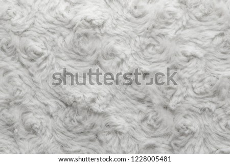 White natural wool with twists texture background. Cotton wool, white fleece carpet. Fur rug with pattern