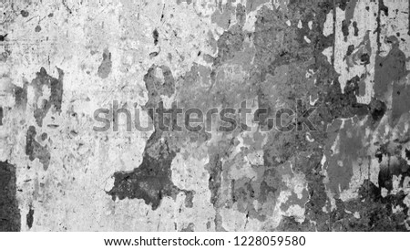 An abstraction of an old dilapidated concrete wall with a black spot