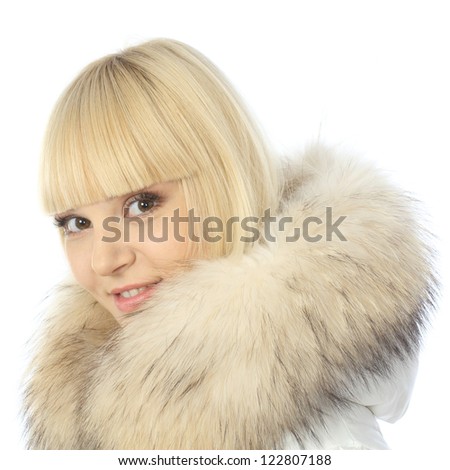 Large portrait of blonde girl in warm jacket with a hood