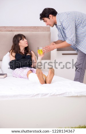 Caring husband looking after his injured wife