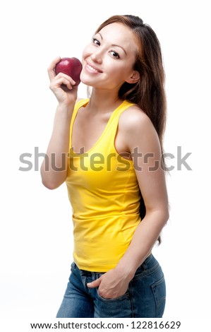 Attractive Mixed Asian female with a red apple