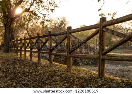 Wood fence in the park Royalty-Free Stock Photo #1228180519