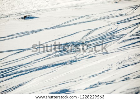 Image of snow surface with ski in winter