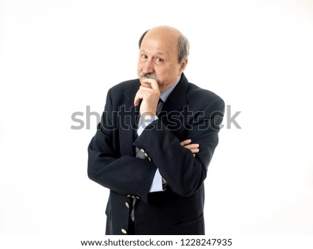 Portrait of old businessman in his 60s worried and thoughtful posing in smart suit isolated on white background in old age and work problem concept.