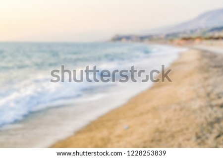 Defocused background with a mediterranean beach in Italy. Intentionally blurred post production for bokeh effect