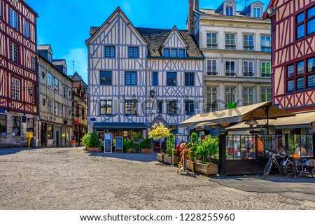 Cozy street with timber framing houses in Rouen, Normandy, France Royalty-Free Stock Photo #1228255960