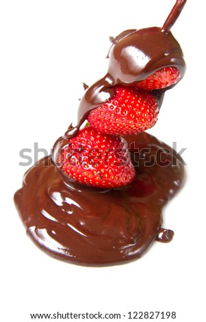 strawberries and chocolate on a white background