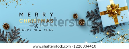 Christmas banner. Background Xmas design of sparkling lights garland, with realistic gifts box, black snowflake and glitter gold confetti. Horizontal christmas poster, greeting cards, headers, website Royalty-Free Stock Photo #1228334410