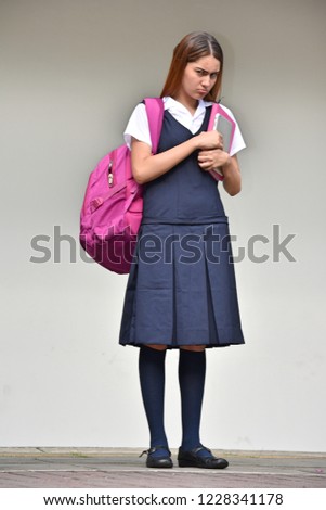 Unhappy Student Teenager School Girl With Books While Standing
