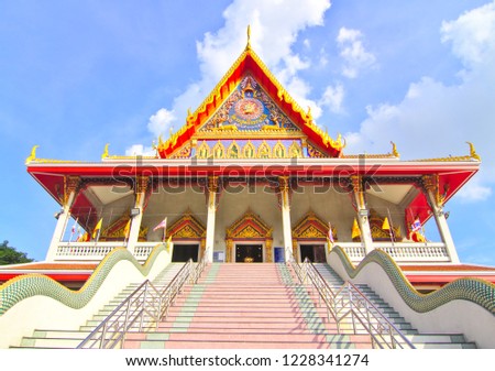 Wat Asoke Ram Samut Prakan, a place of worship of Thai people in Samut Prakan, Thailand. And white clouds and blue skies are the background. There are Thai characters that write .Wihar suththi thrrm 