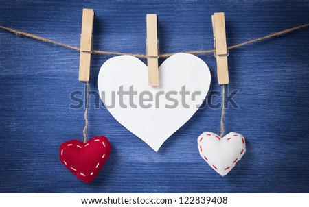 blank white heart with two textile, valentines background