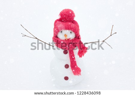 Snowman in a knitted hat