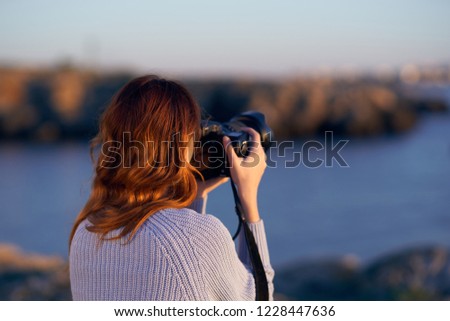 woman takes pictures of nature                       
