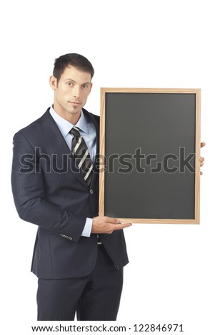 Young businessman holding blank board over a white background