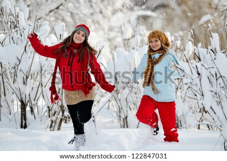 young women outdoor in winter enjoying the snow