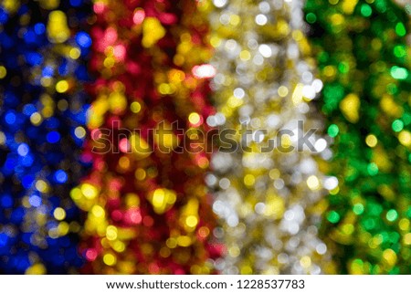 Abstract blurred / defocused of green red blue gold white blurred bokeh Christmas garland wreath light background