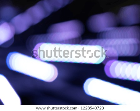 Diagonal neon purple illumination bokeh background