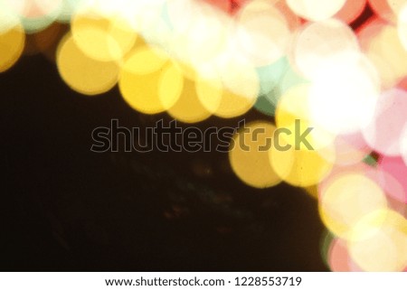 Festive elegant abstract background with bokeh colorful lights Texture. Christmas wallpaper decorations concept. Xmas holiday festival backdrop.
