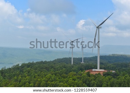 Wind turbine Situated on a hill in the countryside of Thailand.