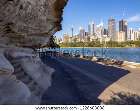 Sydney city skyline with sandstone in the foreground