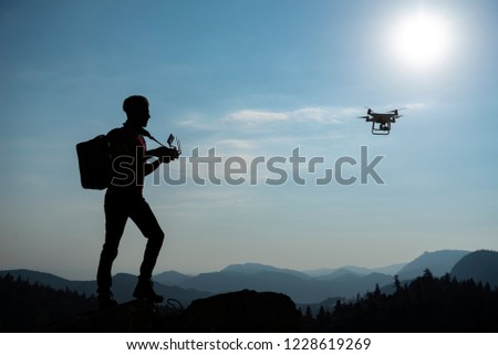 use of drone in mountains, piloting and media work Royalty-Free Stock Photo #1228619269
