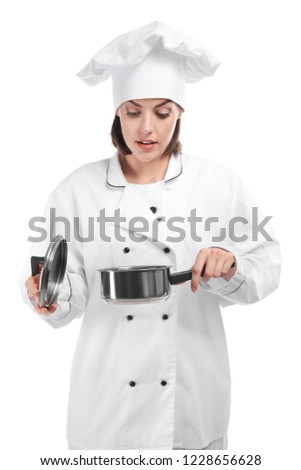 Young female chef with pot on white background