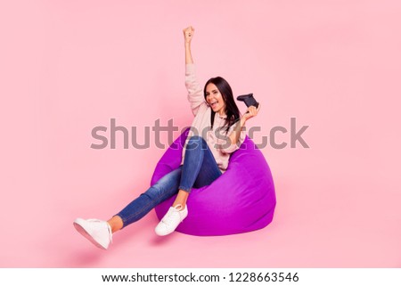 Full legs body size leisure lifestyle lady with her raised fist up she wear in trendy denim jeans urban outfit style stylish pullover sweatshirt shoes sit isolated on vivid pink background