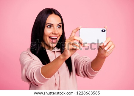 Half turn incredible unbelievable lady blogger take picture with her open mouth staring eyes she wear in urban casual sweatshirt outfit isolated on shine pink background hold cellular