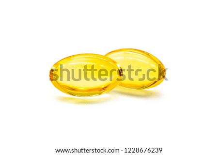 Close up of oil filled capsules (soft gel) suitable for presenting food supplements: fish oil, omega 3, omega 6, omega 9, vitamin A, vitamin D, vitamin D3, vitamin E, evening primrose oil, borage oil. Royalty-Free Stock Photo #1228676239