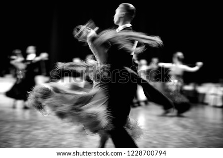 ballroom dance couple dancers waltz blurred motion black-and-white Royalty-Free Stock Photo #1228700794