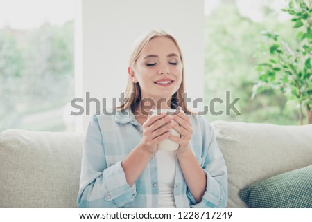 Daytime daydream morning living room she people person concept. Close up photo portrait of pleased peaceful glad calm contented fantasizing student lady hugging cut with fingers