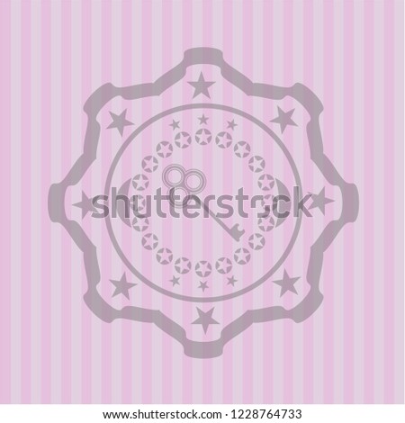 key icon inside badge with pink background