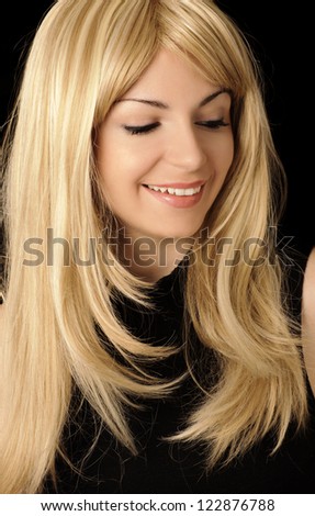 Pretty young woman with layered honey blond hairstyle, smiling Royalty-Free Stock Photo #122876788