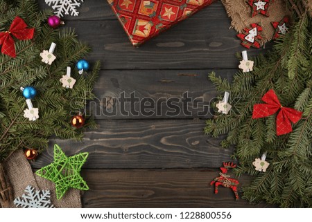 spruce branches on a wooden background. Christmas background, top view. Holiday greeting card. Copy spase, spase for text.